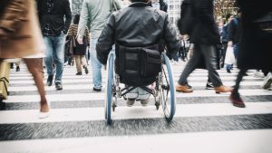 A Japanese man in a wheelchair in the Shibuya Ward of Tokyo, Japan.