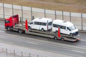 New minibuses to be transported on a trailer truck, delivery to dealers