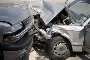 head on collision between car and truck close-up.