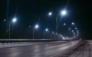 winter highway at night shined with lamps. winter highway