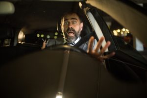 Front view of shocked mid aged businessman facing a car crash after using his phone while driving.Distracted mid adult driver facing a car crash after using his phone while driving.