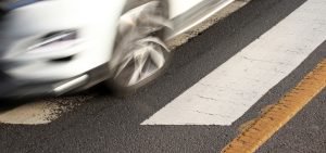 motion blur of a white car on the road