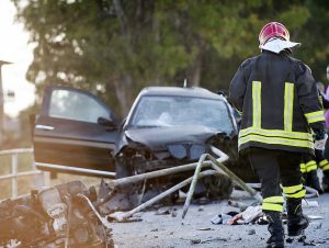A Firefighter walks to the accident site to provide some help.