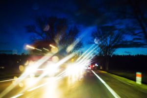 Traffic of cars on the night rainy road. Taken at night while moving for the concept of car accident risk.
